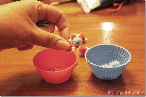 pom poms in cups 2