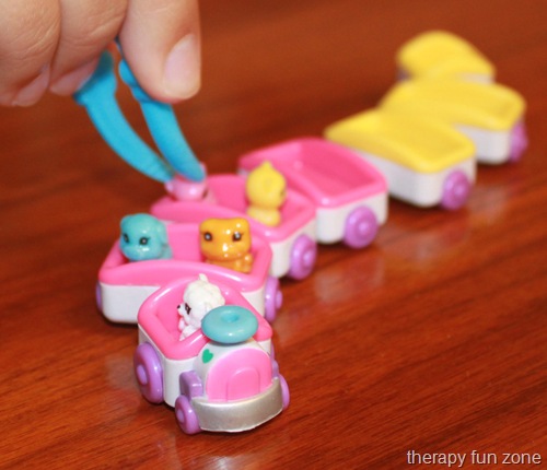 Using tiny toys (Zinkies) as fine motor manipulatives
