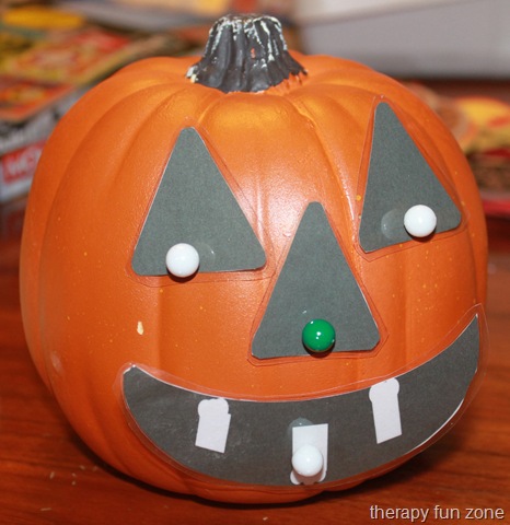 Craft Jack-O-Lantern using pins and face parts for fine motor skills