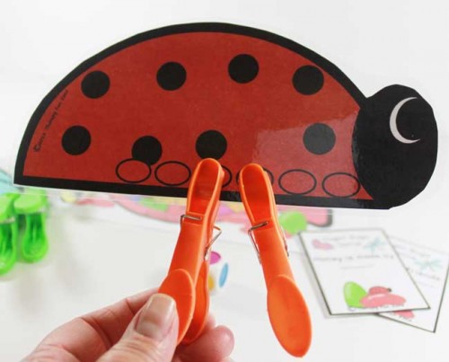 Great clothespin game to work on fine motor skills. put the legs (clothespins) on the bugs.